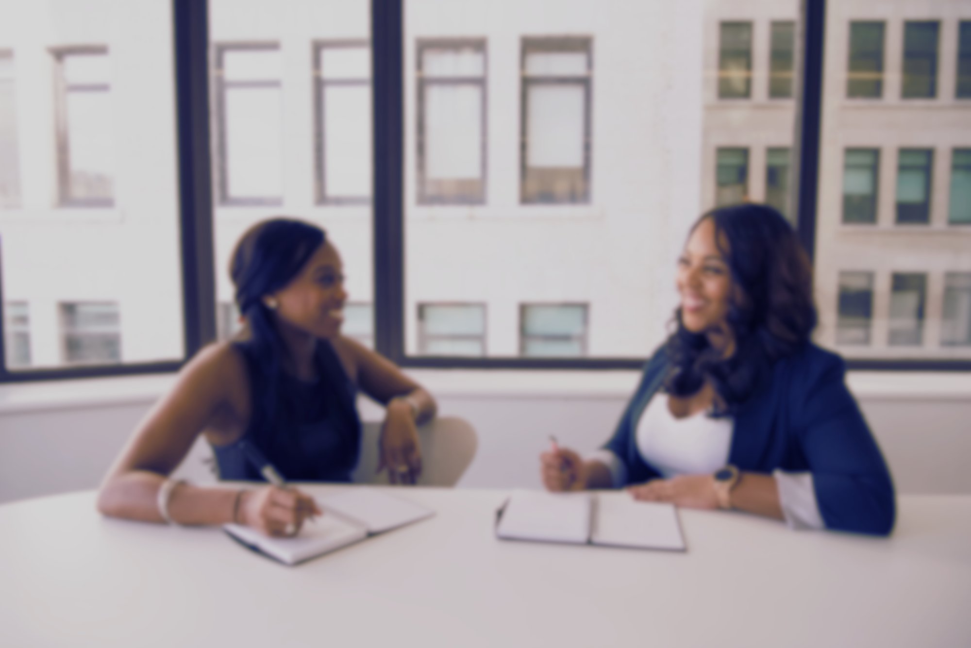 Black women business leaders in a boardroom possibly discussing working with ALJ Digital LLC.